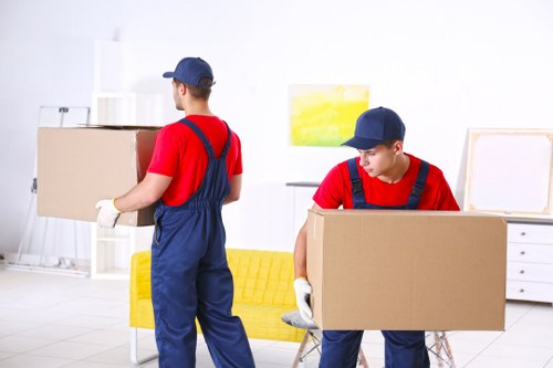 Man And A Van Putney team preparing a safe moving service with protective equipment
