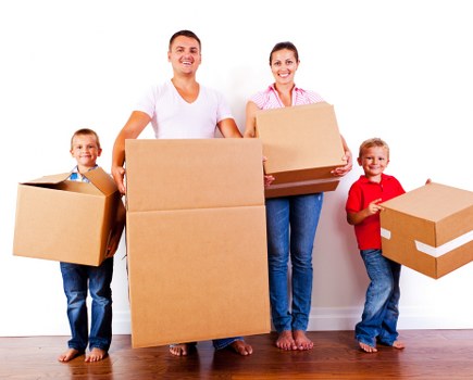 Packing boxes in a Putney home with careful organisation