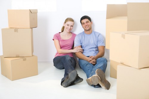 Packers securing fragile household items for a Putney move