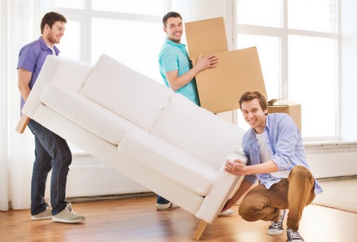Piano removals team handling a piano move in Putney