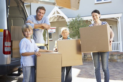 Local Putney moving team organising belongings during unpacking