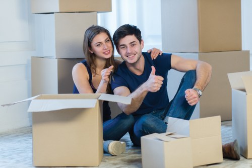 Movers transporting household items during a Putney move