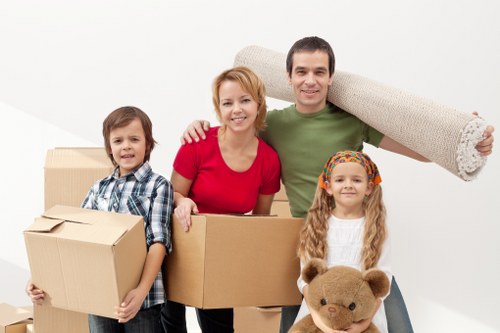 Professional movers handling furniture during a Putney home move