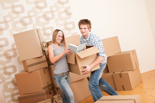 Professional movers packing household items in Putney